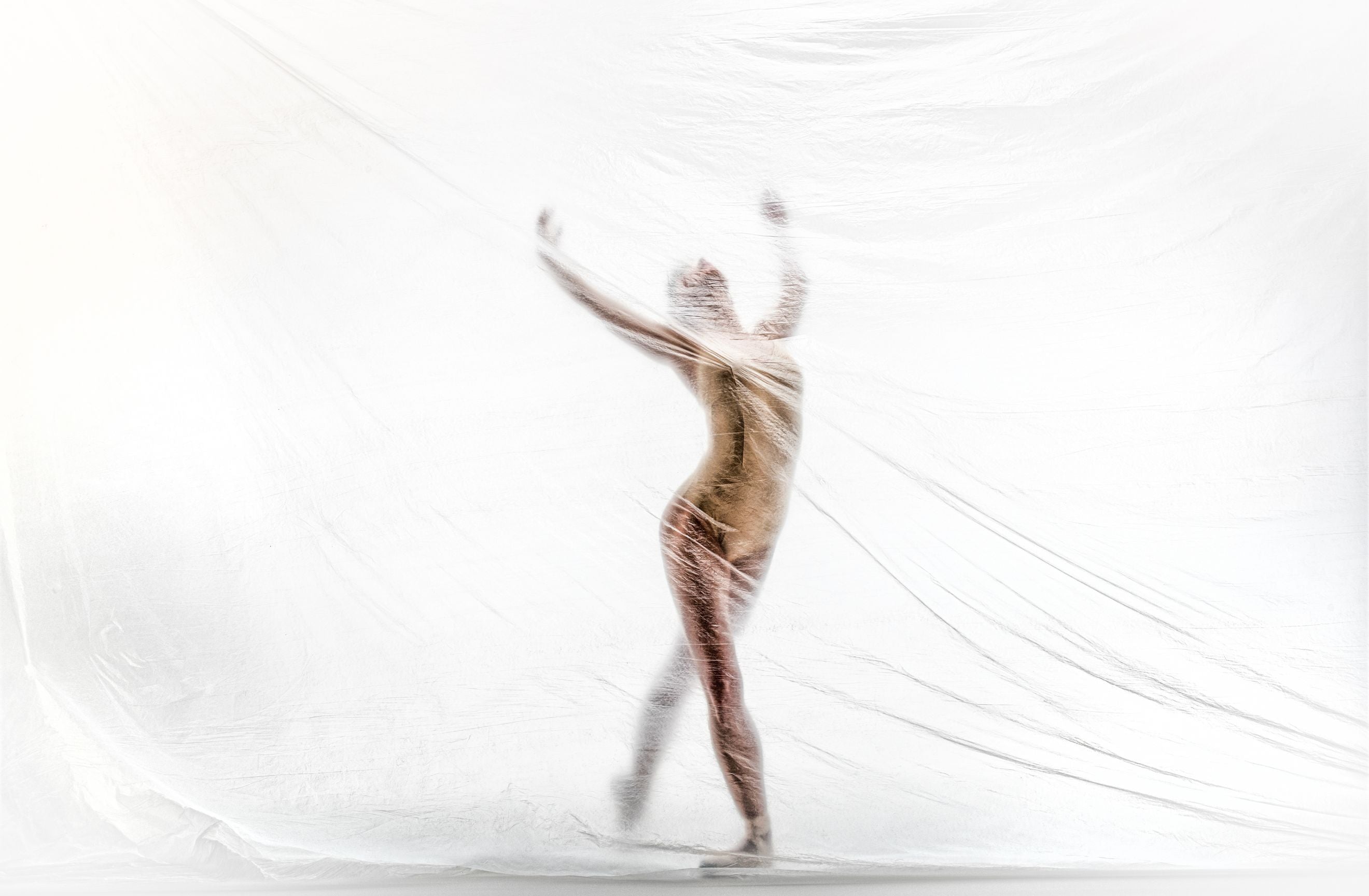 Dancer moving through fabric