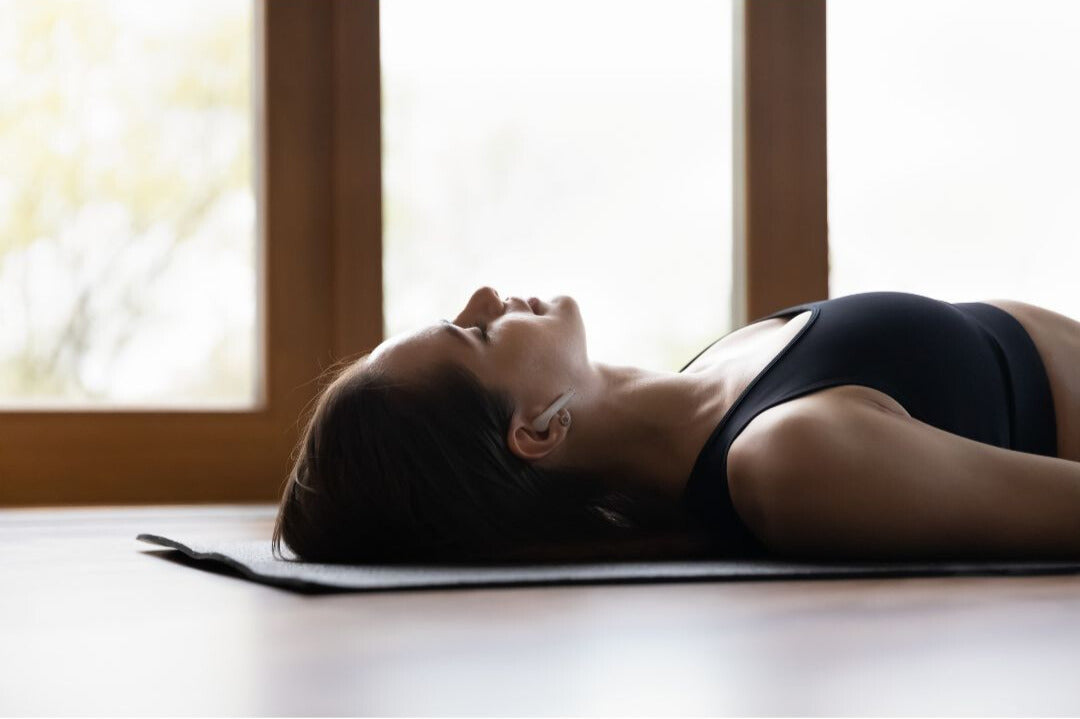 Woman resting on mat