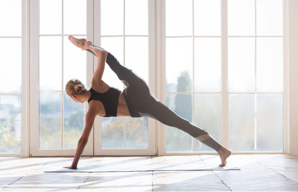 woman doing a split in yoga pose